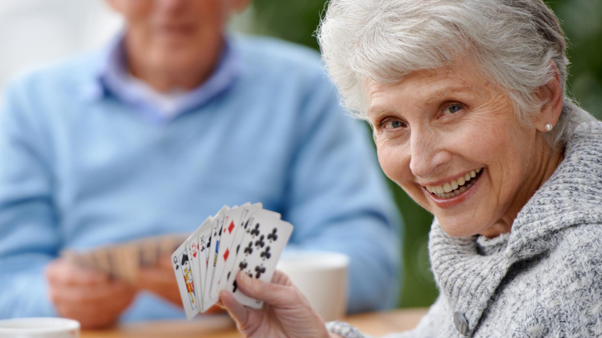 senior lady playing cards