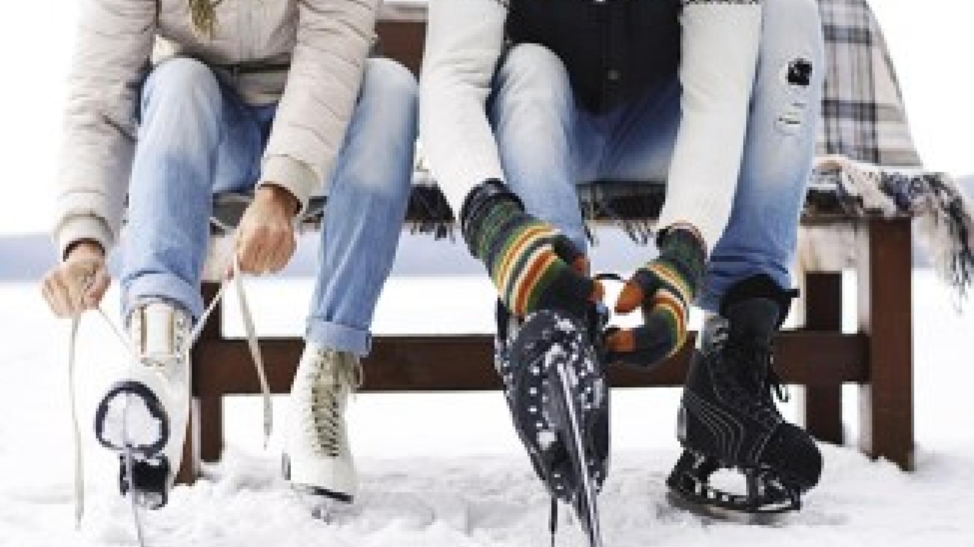 people putting on ice skates