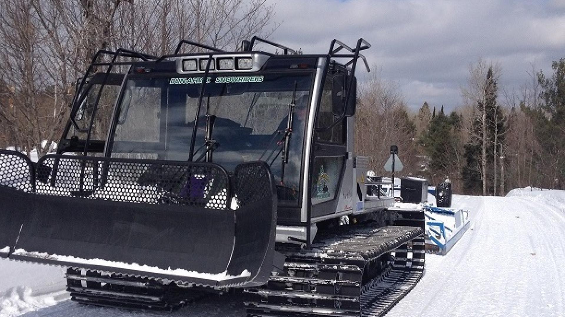 groomer on snowmobile trail