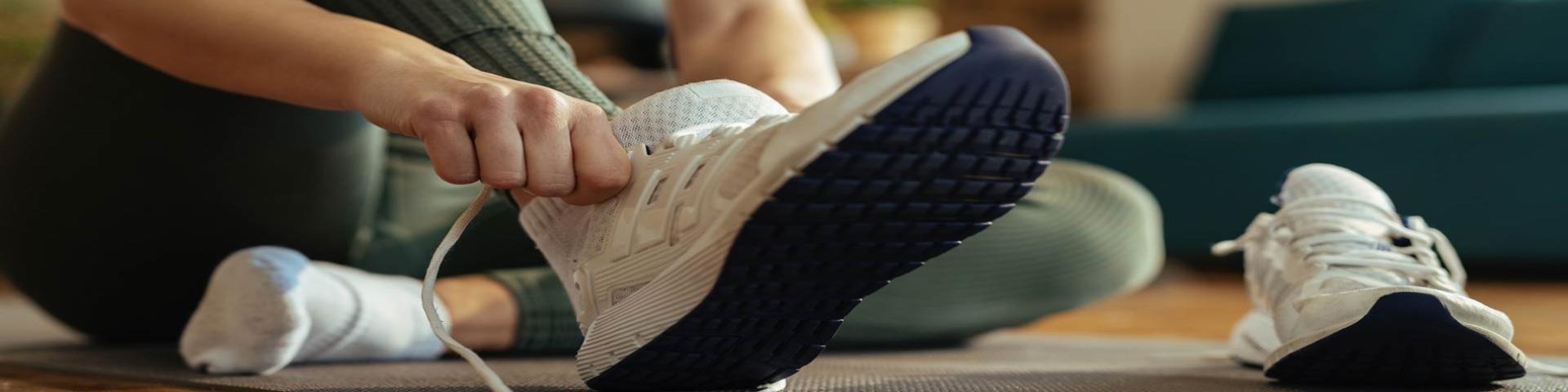 person putting on running shoes