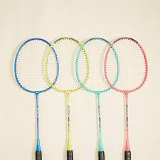 Four badminton rackets in blue, green, yellow, and pink, arranged side by side.